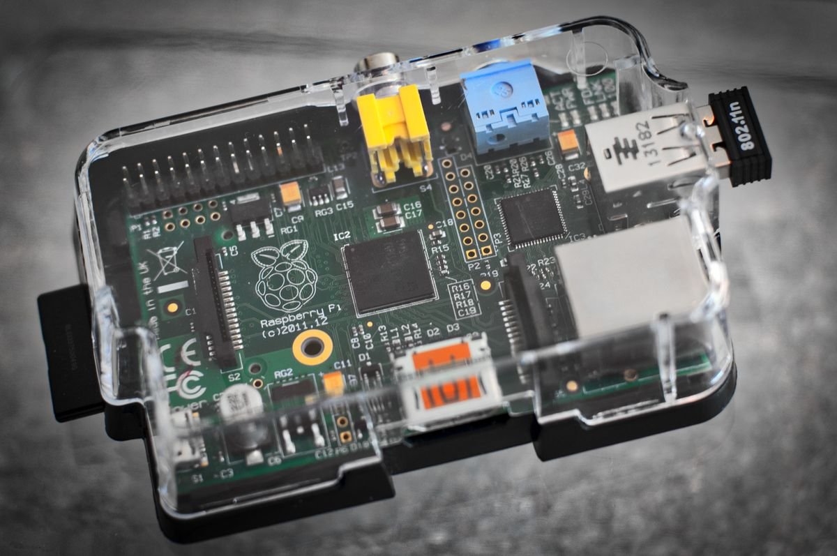 Single-board computer in a clear case, showing chips and connectors